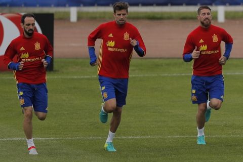 Spain's players from left to right: Juanfran, Gerard Pique, Sergio Ramos and Jordi Alba attends a training session at the Sports Complex Marcel Gaillard in Saint Martin de Re in France, Tuesday, June 14, 2016. Spain will face against Turkey in a Euro 2016 Group D soccer match in Nice on Friday. (AP Photo/Manu Fernandez)
