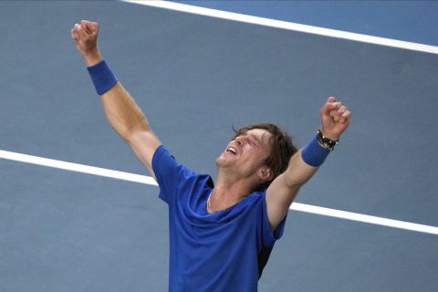 Andrey Rublev of Russia celebrates after defeating Holger Rune of Denmark in their fourth round match at the Australian Open tennis championship in Melbourne, Australia, Monday, Jan. 23, 2023. (AP Photo/Dita Alangkara)