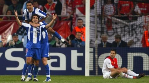 FC Porto's Deco celebrates with teammate Derlei on his shoulders after he scored the second goal for his team during the UEFA Champions League Final between AS Monaco and  FC Porto in the 'Arena AufSchalke' in Gelsenkirchen, Germany, Wednesday, May 26, 2004. AS Monaco's Andreas Zikos looks on at right. (AP Photo/Frank Augstein)