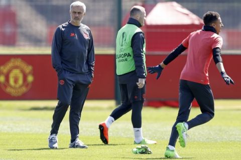 Manchester United's  manager Jose Mourinho watches over his team's training session at the team's training complex in Manchester,  England Wednesday May 10, 2017. United will play against Celta Vigo in a Europa League semifinal second leg soccer match on Thursday.  (Martin Rickett//PA via AP)