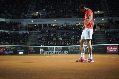 Novak Djokovic of Serbia walks on the court after losing a point to Diego Schwartzman of Argentina during a semifinal match at the Italian Open tennis tournament, in Rome, Saturday, May 18, 2019. (AP Photo/Andrew Medichini)