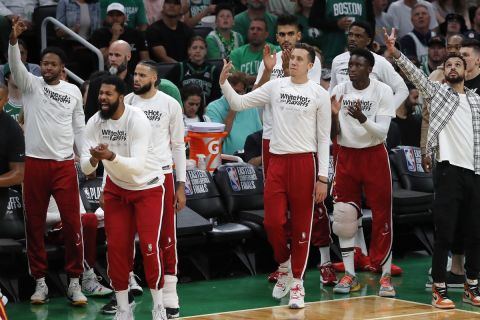 The Miami Heat bench reacts to a 3-pointer by Kyle Lowry against the Boston Celtics during the first half of Game 6 of the NBA basketball playoffs Eastern Conference finals Friday, May 27, 2022, in Boston. (AP Photo/Michael Dwyer)