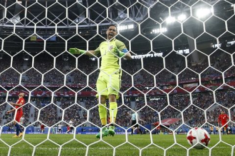 Chile goalkeeper Claudio Bravo reacts after Germany's Lars Stindl scored the opening goal during the Confederations Cup final, soccer match between Chile and Germany, at the St.Petersburg Stadium, Russia, Sunday July 2, 2017. (AP Photo/Martin Meissner)