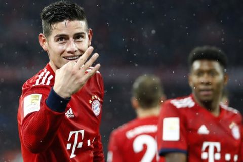 Bayern's James celebrates after his side's fifth goal during the German Bundesliga soccer match between FC Bayern Munich and 1. FSV Mainz 05 in Munich, Germany, Sunday, March 17, 2019. (AP Photo/Matthias Schrader)