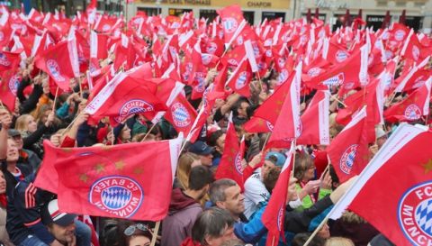 Fans of FC Bayern Munich wait for the team to celebrate the  German soccer Championships on Marienplatz square in Munich, Germany, Sunday May 15, 2016. (Karl-Josef Hildenbrand)