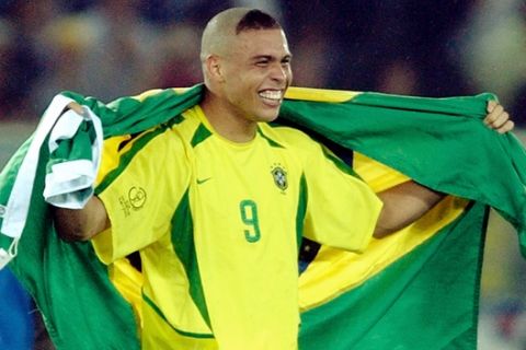 Brazil forward Ronaldo celebrates with the Brazilian flag after they defeated Germany 2-0 in the 2002 World Cup final Sunday, June 30, 2002 in Yokohama, Japan. (AP Photo/Amy Sancetta)
