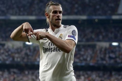 Real midfielder Gareth Bale celebrates after scoring his side's second goal during a Group G Champions League soccer match between Real Madrid and Roma at the Santiago Bernabeu stadium in Madrid, Spain, Wednesday Sept. 19, 2018. (AP Photo/Manu Fernandez)