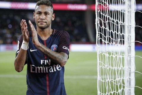 PSG's Neymar applauds with supporters after the French League One soccer match between PSG and Toulouse at the Parc des Princes stadium in Paris, France, Sunday, Aug. 20, 2017. (AP Photo/Kamil Zihnioglu)