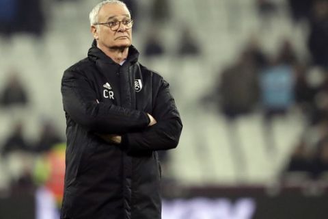 Fulham manager Claudio Ranieri watches the warmup ahead of the English Premier League soccer match between West Ham and Fulham at the London Stadium in London, Friday, Feb. 22, 2019. (AP Photo/Matt Dunham)