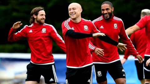 Wales' Joe Allen, left, David Cotterill and Ashley Williams attend a training session in Dinard, western France, Tuesday, July 5, 2016. Wales will face Portugal in a Euro 2016 semifinal match at the Grand Stade in Decines-Charpieu, near Lyon, France, Wednesday, July 6, 2016. (AP Photo/David Vincent)