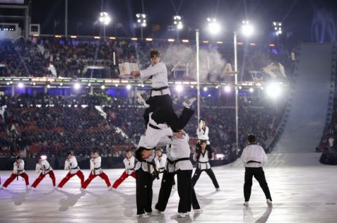 Martial arts practitioners perform ahead of the opening ceremony of the 2018 Winter Olympics in Pyeongchang, South Korea, Friday, Feb. 9, 2018. (AP Photo/Jae C. Hong)