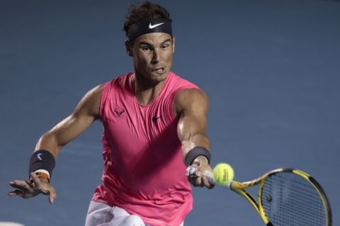 Spain's Rafael Nadal returns a ball in his second-round match against Serbia's Miomir Kecmanovic at the Mexican Open tennis tournament in Acapulco, Mexico, Wednesday, Feb. 26, 2020. (AP Photo/Rebecca Blackwell)