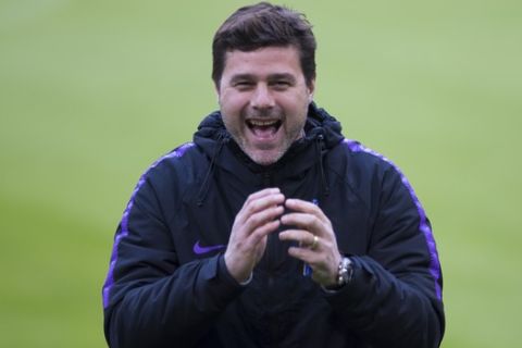 Tottenham coach Mauricio Pochettino laughs during a training at the Johan Cruyff Arena in Amsterdam, Netherlands, Tuesday, May 7, 2019. Ajax will play Tottenham Hotspur in the Champions League semifinal, second leg, soccer match on Wednesday May 8, 2019. (AP Photo/)