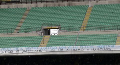 Inter Milan supporters hold up a banner reading in Italian "since you don't can't earn our support, today we salute you and we go to eat" during the Serie A soccer match between Inter Milan and Sassuolo at the San Siro stadium in Milan, Italy, Sunday, May 14, 2017. (AP Photo/Antonio Calanni)