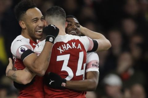Arsenal's Pierre-Emerick Aubameyang celebrates after scoring his side's fourth goal during the English Premier League soccer match between Arsenal and Fulham at Emirates stadium in London, Tuesday, Jan. 1, 2019. (AP Photo/Kirsty Wigglesworth)