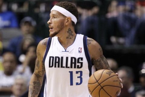 In this Oct. 15, 2012 photo, Dallas Mavericks guard Delonte West (13) moves the ball against the Houston Rockets in the 123-104 Mavericks win in a preseason NBA basketball game in Dallas. West has been suspended for conduct detrimental to the team. Team spokeswoman Sarah Melton said Tuesday, Oct. 16, 2012, that coach Rick Carlisle didn't indicate how long the suspension would be. (AP Photo/Tony Gutierrez)