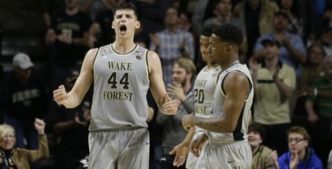 Wake Forest's Konstantinos Mitoglou (44) reacts in the second half of an NCAA college basketball gameagainst Louisville in Winston-Salem, N.C., Wednesday, March 1, 2017. Wake Forest won 88-81. (AP Photo/Chuck Burton)