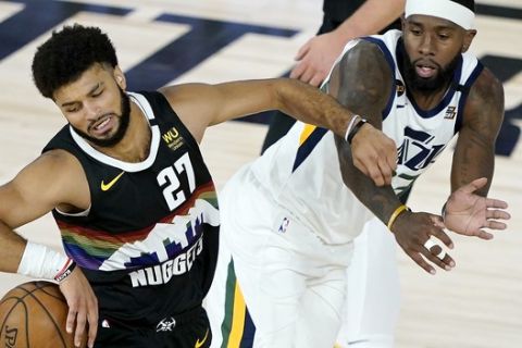 Denver Nuggets' Jamal Murray (27) drives against Utah Jazz's Royce O'Neale during the first half of an NBA basketball first round playoff game, Monday, Aug. 17, 2020, in Lake Buena Vista, Fla. (AP Photo/Ashley Landis, Pool)