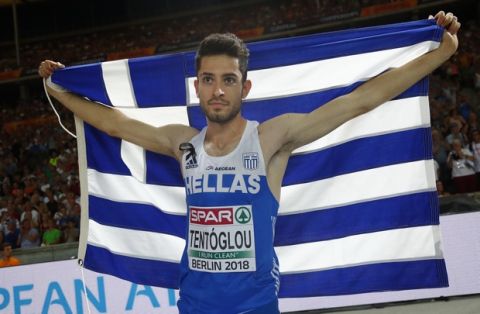Greece's Miltiadis Tentoglou celebrates after winning the gold medal in the men's long jump final at the European Athletics Championships at the Olympic stadium in Berlin, Germany, Wednesday, Aug. 8, 2018. (AP Photo/Matthias Schrader)