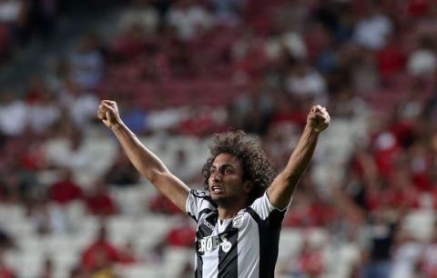 PAOK's Amr Warda celebrates scoring his side's first goal during the Champions League playoffs, first leg, soccer match between Benfica and PAOK at the Luz stadium in Lisbon, Tuesday, Aug. 21, 2018. (AP Photo/Armando Franca)