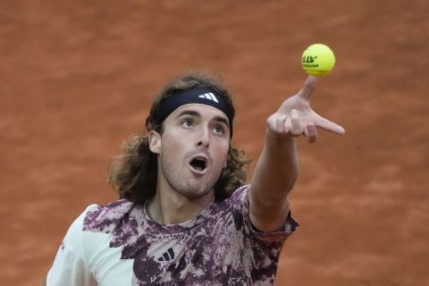 Stefanos Tsitsipas, of Greece, serves the ball to Daniil Medvedev, of Russia, during their semi final match at the Italian Open tennis tournament in Rome, Italy, Saturday, May 20, 2023. (AP Photo/Gregorio Borgia)