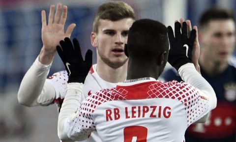Leipzig's Naby Keita, right, celebrates together with Leipzig's Timo Werner, left, after scoring a goal during the German first division Bundesliga soccer match between RB Leipzig and Bayern Munich in Leipzig, Germany, Sunday, March 18, 2018. (AP Photo/Jens Meyer)
