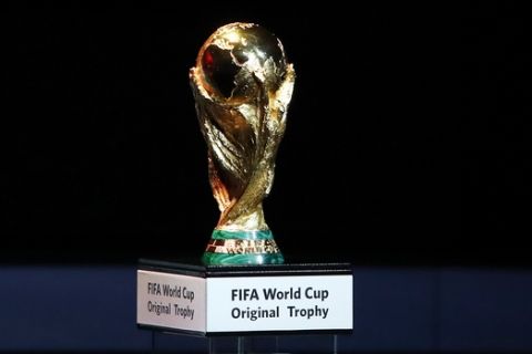 FILE - A Friday Dec. 1, 2017 file photo of the World Cup trophy placed on display during the 2018 soccer World Cup draw in the Kremlin in Moscow. Morocco has touted its limited threat from gun crime in a 2026 World Cup bidding proposal to take on the United States-led rival for the 2026 soccer showpiece. The North African nation highlights safety for visiting fans in bidding documents published by FIFA on Monday that do however show every stadium and training ground requires building work. (AP Photo/Pavel Golovkin, File)