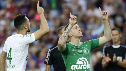 Chapecoense's Follmann, right, and Neto react after the honour kickoff during the Joan Gamper trophy friendly soccer match between FC Barcelona and Chapecoense at the Camp Nou stadium in Barcelona, Spain, Monday, Aug. 7, 2017. (AP Photo/Manu Fernandez)
