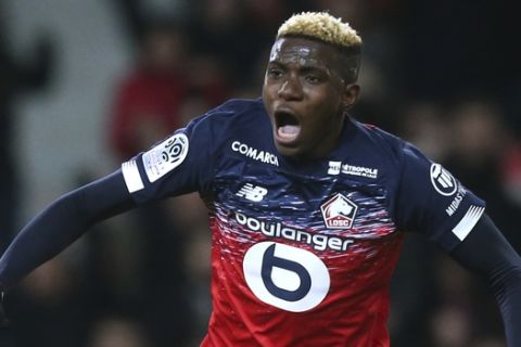 Lille's Victor Osimhen, reacts after the first goal during his French League One soccer match between Lille and Lyon at the Lille Metropole stadium in Villeneuve d'Ascq, northern France, Sunday, March 8, 2020. (AP Photo/Michel Spingler)