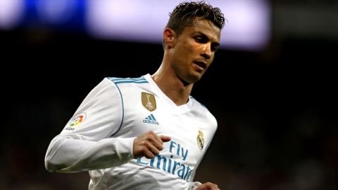 Real Madrid's Cristiano Ronaldo runs during a Spanish La Liga soccer match between Real Madrid and Athletic Bilbao at the Santiago Bernabeu stadium in Madrid, Wednesday, April 18, 2018. Ronaldo scored once and the match ended in a 1-1 draw. (AP Photo/Francisco Seco)