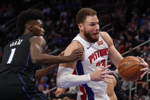Detroit Pistons forward Blake Griffin (23) drives as Orlando Magic forward Jonathan Isaac (1) defends during the first half of an NBA basketball game, Wednesday, Jan. 16, 2019, in Detroit. (AP Photo/Carlos Osorio)