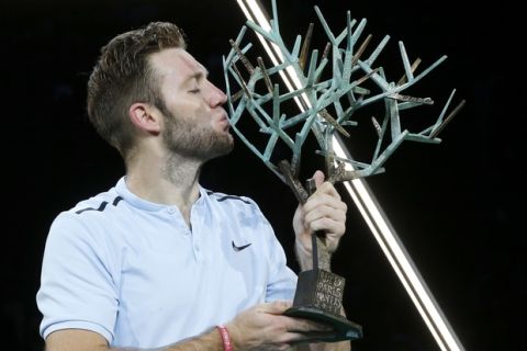 Jack Sock of the United States kisses the trophy after he defeated Filip Krajinovic of Serbia during their final match of the Paris Masters tennis tournament at the Bercy Arena in Paris, France, Sunday, Nov. 5, 2017. (AP Photo/Michel Euler)