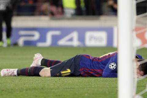 Barcelona's Lionel Messi reacts after Barcelona's Ousmane Dembele missed a scoring opportunity during the Champions League semifinal, first leg, soccer match between FC Barcelona and Liverpool at the Camp Nou stadium in Barcelona, Spain, Wednesday, May 1, 2019. (AP Photo/Emilio Morenatti)