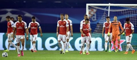 Arsenal's players react following a second goal by Dinamo, during the UEFA Champions League Group F football match between GNK Dinamo Zagreb and Arsenal FC at Maksimir Stadium in Zagreb on September 16, 2015.  AFP PHOTO / ANDREJ ISAKOVIC        (Photo credit should read ANDREJ ISAKOVIC/AFP/Getty Images)