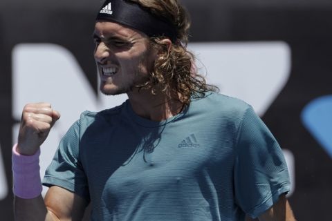 Greece's Stefanos Tsitsipas reacts after winning a point against Italy's Matteo Berrettini during their first round match at the Australian Open tennis championships in Melbourne, Australia, Monday, Jan. 14, 2019. (AP Photo/Mark Schiefelbein)