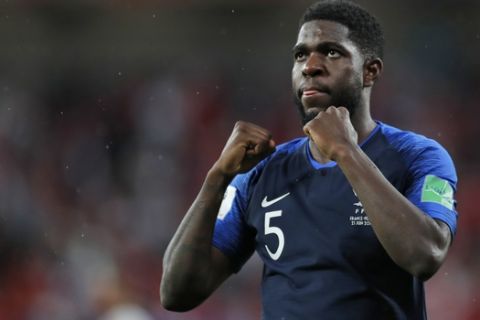 France's Samuel Umtiti jubilates at the end of the group C match between France and Peru at the 2018 soccer World Cup in the Yekaterinburg Arena in Yekaterinburg, Russia, Thursday, June 21, 2018. (AP Photo/Natacha Pisarenko)