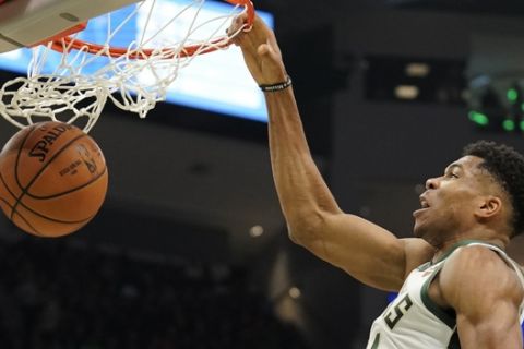 Milwaukee Bucks' Giannis Antetokounmpo duns during the second half of an NBA basketball game against the Memphis Grizzlies Wednesday, Nov. 14, 2018, in Milwaukee. The Grizzlies won 116-113. (AP Photo/Morry Gash)