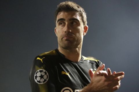 Dortmund's Sokratis leaves the pitch after the Champions League Group H soccer match between APOEL Nicosia and Borussia Dortmund at GSP stadium, in Nicosia, Cyprus, on Tuesday, Oct. 17, 2017. (AP Photo/Petros Karadjias)