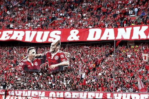 Bayern's supporters display portraits of the players Franck Ribery and Arjen Robben prior to the German Bundesliga soccer match between FC Bayern Munich and Eintracht Frankfurt in Munich, Germany, Saturday, May 18, 2019. Slogan reads 'Bye, Bye and Thank You'. (AP Photo/Matthias Schrader)