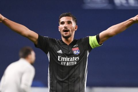 Lyon's Houssem Aouar celebrates after his team's win in the Champions League quarterfinal match against Manchester City at the Jose Alvalade stadium in Lisbon, Portugal, Saturday, Aug. 15, 2020. (Franck Fife/Pool Photo via AP)
