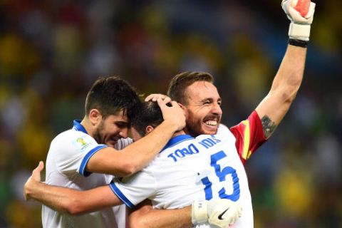FORTALEZA, BRAZIL - JUNE 24: (L-R) Konstantinos Manolas, Vasilis Torosidis and Panagiotis Glykos of Greece celebrate after defeating the Ivory Coast 2-1 during the 2014 FIFA World Cup Brazil Group C match between Greece and the Ivory Coast at Castelao on June 24, 2014 in Fortaleza, Brazil.  (Photo by Jamie McDonald/Getty Images)