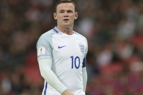 Englands Wayne Rooney walks to take a corner during the World Cup Group F qualifying soccer match between England and Malta at Wembley stadium in London, Saturday Oct. 8, 2016. (AP Photo/Tim Ireland)