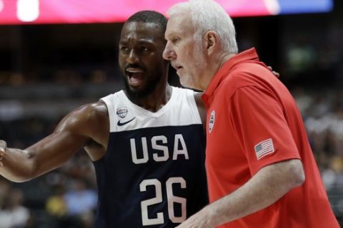 United States' Kemba Walker, left, talks to  coach Gregg Popovich during the first half of the team's exhibition basketball game against Spain on Friday, Aug. 16, 2019, in Anaheim, Calif. (AP Photo/Marcio Jose Sanchez)