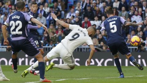 Real Madrid's Karim Benzema heads the ball on goal during a Spanish La Liga soccer match between Real Madrid and Valladolid at the Santiago Bernabeu stadium in Madrid, Spain, Saturday, Nov. 3, 2018. (AP Photo/Paul White)