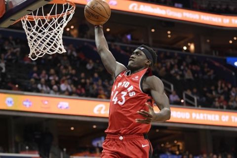 Toronto Raptors forward Pascal Siakam (43) goes to the basket during the first half of an NBA basketball game against the Washington Wizards, Sunday, Jan. 13, 2019, in Washington. (AP Photo/Nick Wass)