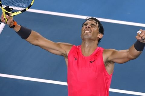 Spain's Rafael Nadal celebrates after defeating Australia's Nick Kyrgios in their fourth round singles match at the Australian Open tennis championship in Melbourne, Australia, Monday, Jan. 27, 2020. (AP Photo/Andy Wong)
