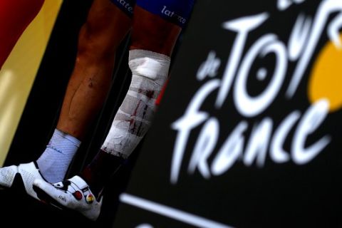 Most combative rider Belgium's Philippe Gilbert celebrates on the podium after the sixteenth stage of the Tour de France cycling race over 218 kilometers (135.5 miles) with start in Carcassonne and finish in Bagneres-de-Luchon, France, , Tuesday, July 24, 2018. (AP Photo/Peter Dejong)