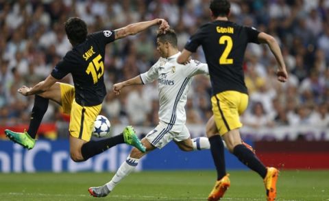 Real Madrid's Cristiano Ronaldo scores his side's 2nd goal during the Champions League semifinal first leg soccer match between Real Madrid and Atletico Madrid at the Santiago Bernabeu stadium in Madrid, Spain, Tuesday, May 2, 2017. (AP Photo/Francisco Seco)