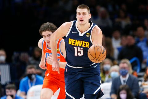 Denver Nuggets center Nikola Jokic (15) leads a fast break in front of Oklahoma City Thunder guard Josh Giddey in the first half of an NBA basketball game Sunday, Jan. 9, 2022, in Oklahoma City. (AP Photo/Nate Billings)