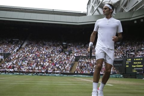 Switzerland's Roger Federer looks down the court after playing a return to Croatia's Marin Cilic during the Men's Singles final match on day thirteen at the Wimbledon Tennis Championships in London Sunday, July 16, 2017. (Daniel Leal-Olivas/Pool Photo via AP)